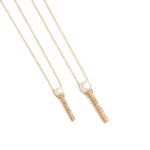 Perla’s gold magic wand necklace 
2